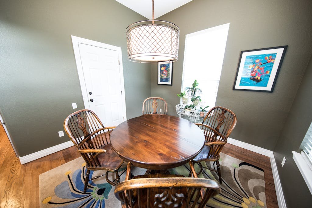 rug under Brown Wooden round Dining Set