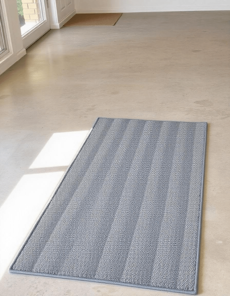 A rug pad on the concrete floor 