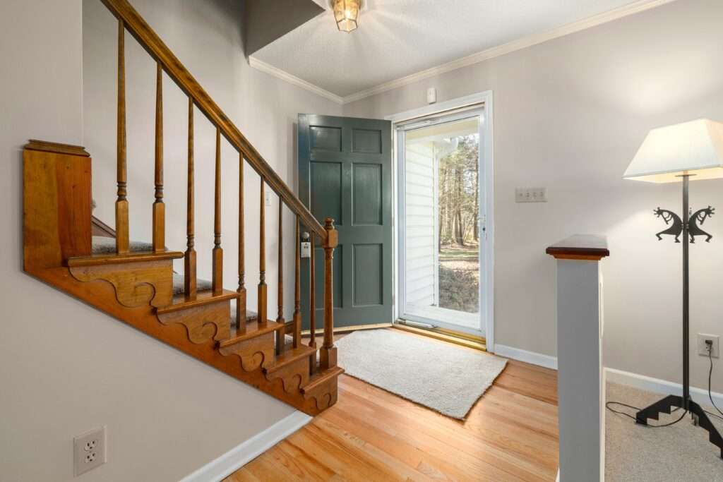 a beautiful hallway with runner rug